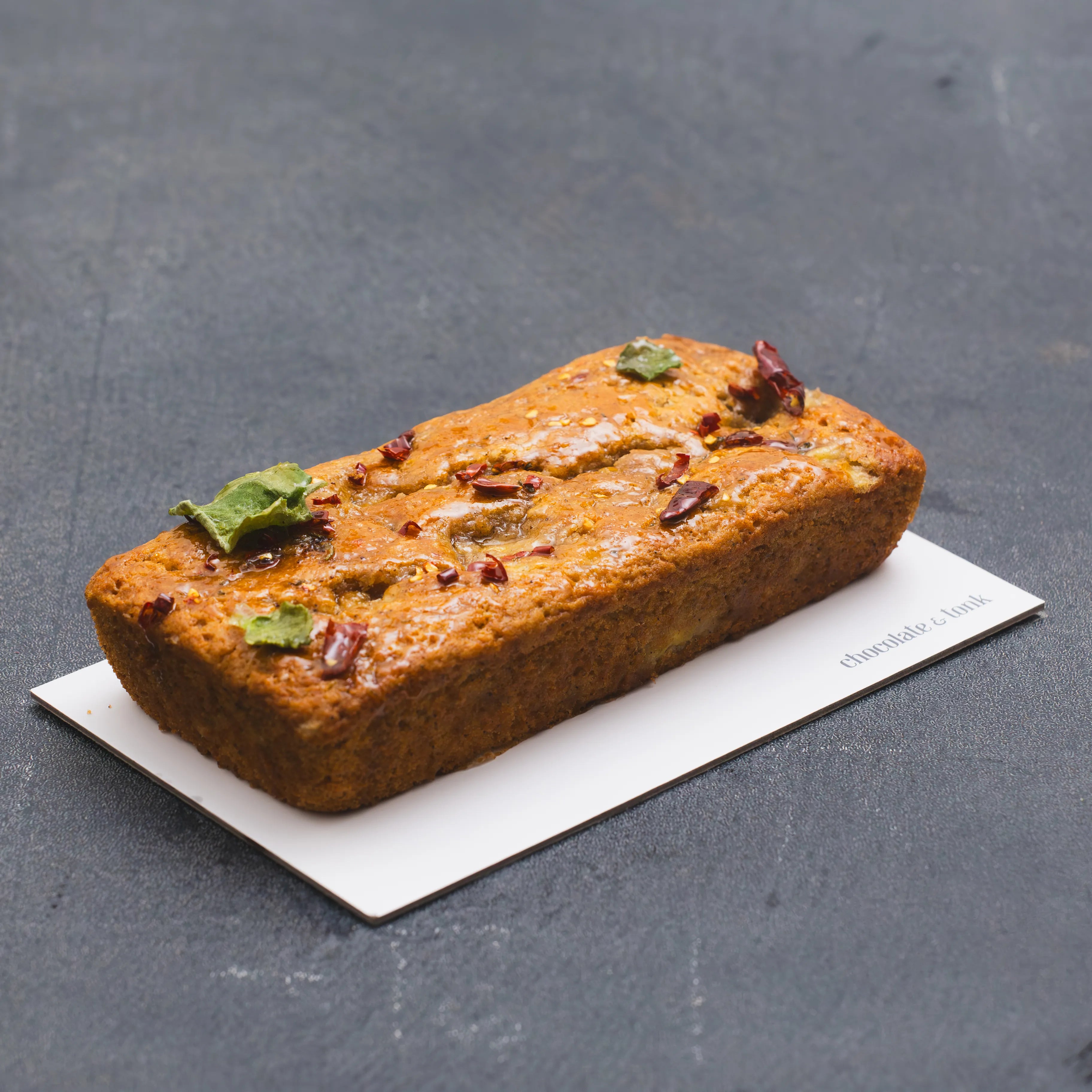 Unique banana bread loaf cake glazed with hot honey and spurflower