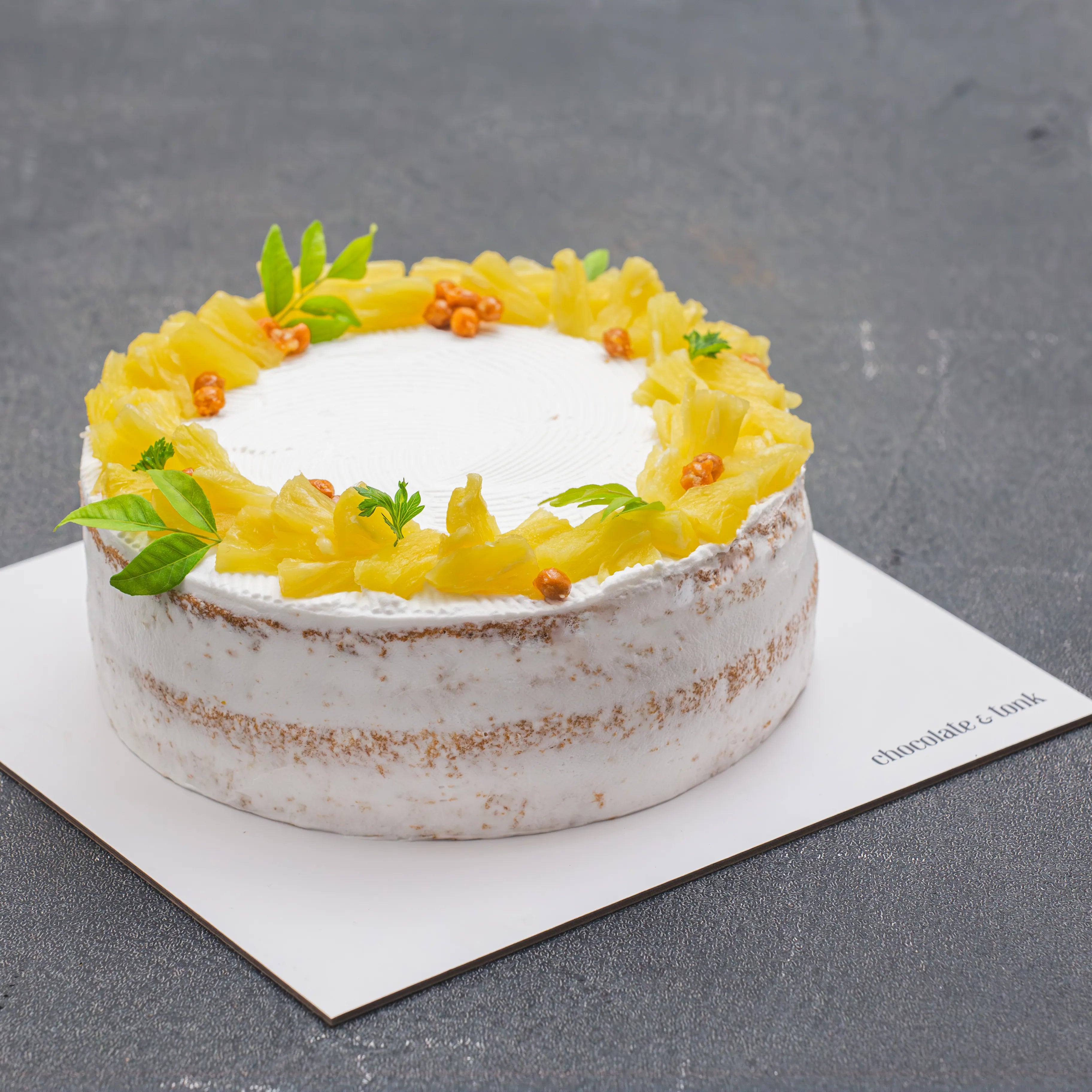 Light and fluffy pineapple cake with creamy frosting